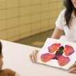 A teacher testing for behavioral or academic problems in adoptees