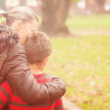 Adoptive mother and son walking and talking about the difficult details of his adoption story