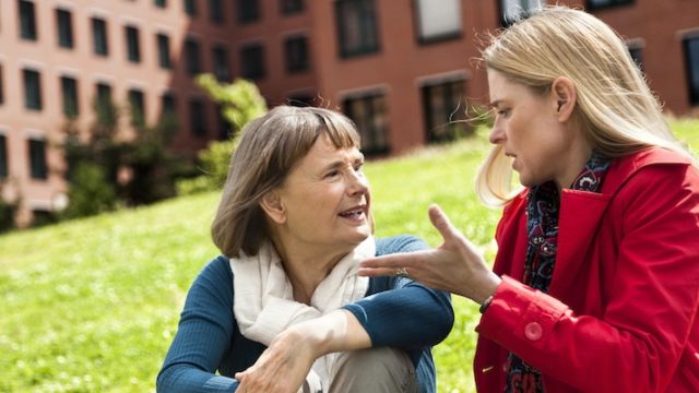 An adoptee and her mother discussing her birth father reunion