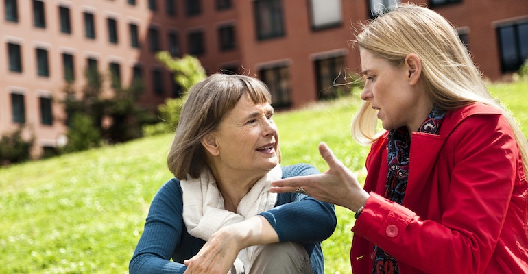 An adoptee and her mother discussing her birth father reunion