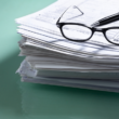 stack of forms you might need to claim the adoption tax credit