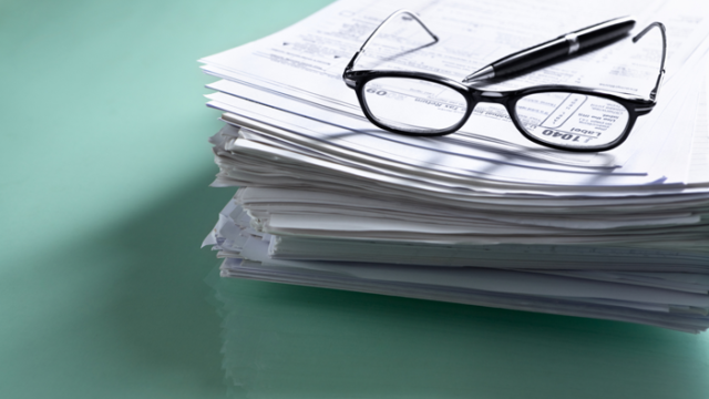 stack of forms you might need to claim the adoption tax credit