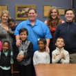 Julia Baxter with her family, including four new siblings through foster adoption, on their adoption day