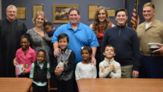 Julia Baxter with her family, including four new siblings through foster adoption, on their adoption day