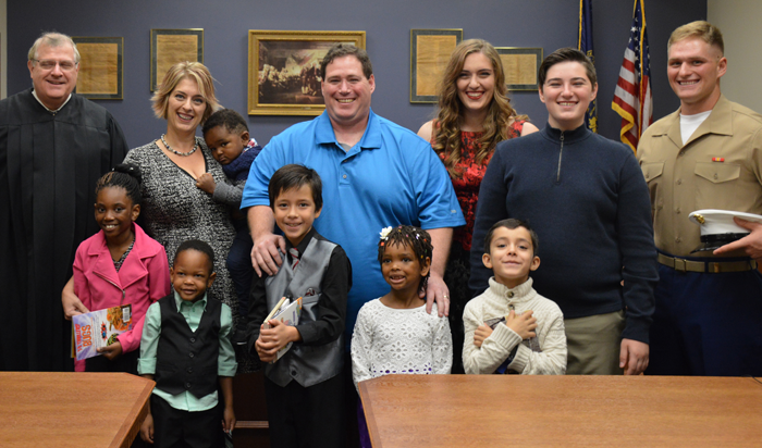 Julia Baxter with her family, including four new siblings through foster adoption, on their adoption day