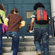 a transracially adopted teen heading into school with friends