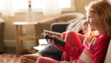 children watching a television show with an adoption theme