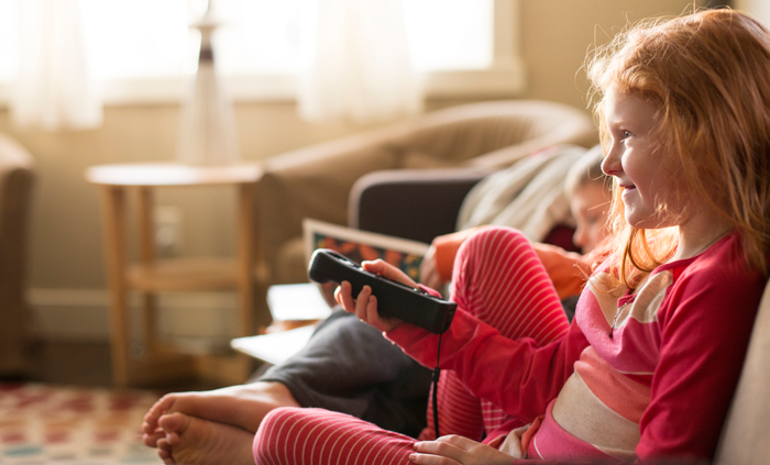 children watching a television show with an adoption theme