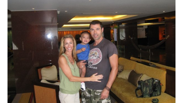 Laurie Shiers with her husband and son adopted from Thailand