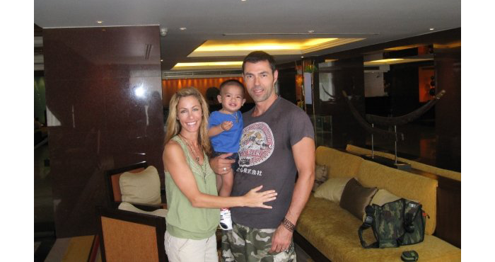 Laurie Shiers with her husband and son adopted from Thailand