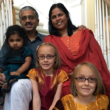 author Lakshmi Iyer with her family, including twins adopted as older infants in an open adoption