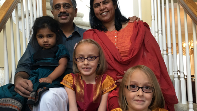 author Lakshmi Iyer with her family, including twins adopted as older infants in an open adoption