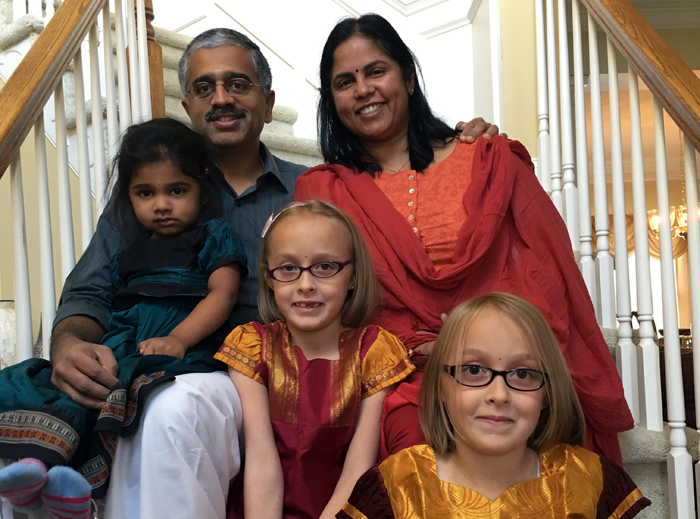 author Lakshmi Iyer with her family, including twins adopted as older infants in an open adoption