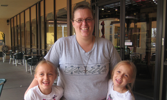 author Brandy Stein with her twin daughters during an open adoption visit