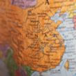 China, pictured on a globe, has recently updated its international adoption requirements