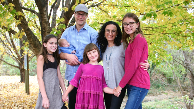 Author Lisa Emmerich and her husband with their three biological children and newborn son through domestic adoption