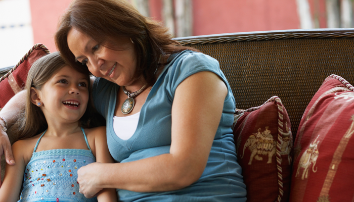 A grandmother and the granddaughter she adopted share a close moment