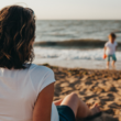 An adoptive mother watches her son at the beach and thinks about contact with his birth mother