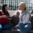 An expectant mother and prospective adoptive mother meet and talk for the first time