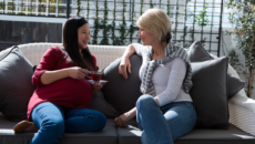 An expectant mother and prospective adoptive mother meet and talk for the first time