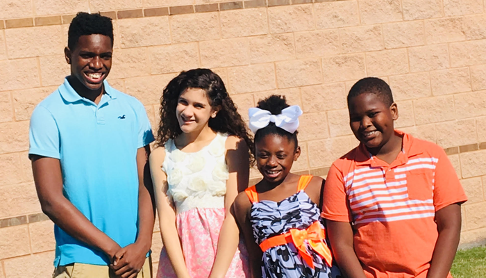 Four of author Billy Cuchens's children through transracial adoption
