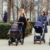 Three mothers pushing strollers in the city, one asking a nosy adoption question